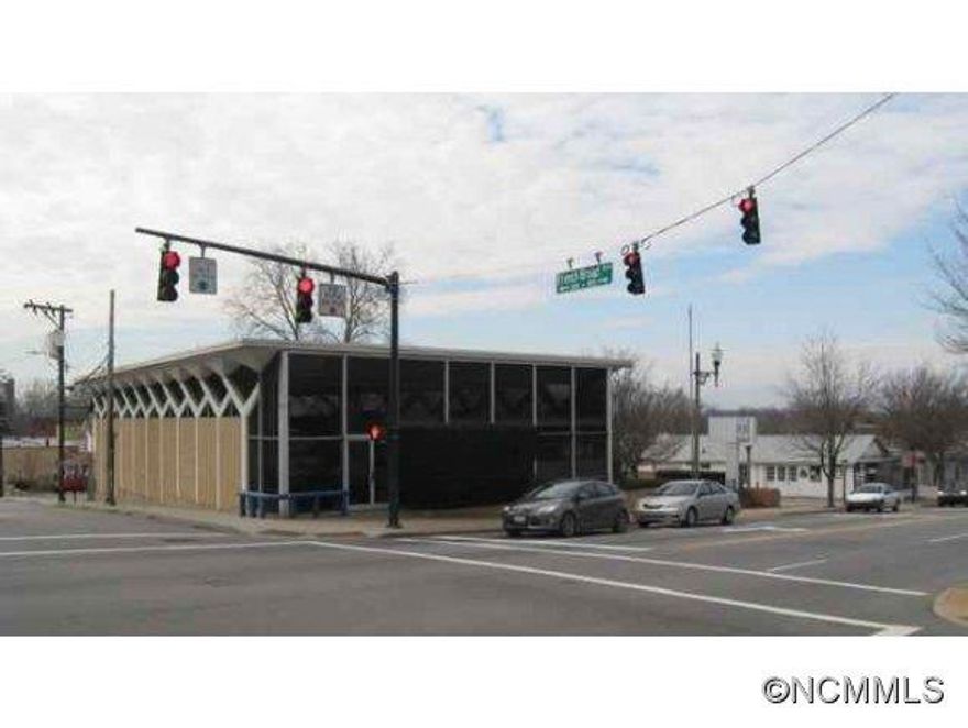 Incredible opportunity in Downtown with corner location and traffic light. includes 4 additional parcels total .63 includes PIN# 9648-29 (0882,1813,1734 and 0851). Short walk to Civic Center, Grover Arcade, Pritchard Park and Central Downtown.  All information subject to Buyers Agent verification, including heated sq. ft. and exact lot size .