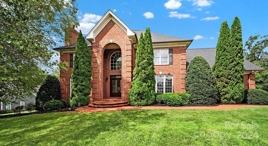 Welcome to this stunning two-story, full brick home on a generous 0.74-acre lot. As you step inside thru the elegant double glass doors, a two-story foyer w/dazzling chandelier & grand staircase greets you. Flanking the foyer are a formal library/office & formal d/r. The heart of the home is the open great room w/tall ceilings featuring a cozy fireplace & floor to ceiling windows. Entertaining kitchen w/granite countertops, SS appliances & pantry. The main-level primary suite is a private retreat w/sitting area. The ensuite bath offers a luxurious jetted tub, a glass-enclosed shower w/dual showerheads, & a spacious DUAL walk-in closet. Upstairs, you’ll find 4 generous guest bedrooms w/access to two full bathrooms, including a jack & jill between the 3rd & 4th rooms. A large bonus room boasts 2 walk-in attic spaces. Outside, a beautiful paver patio overlooks the expansive backyard, perfect for relaxation & entertaining. Extended driveway w/in-ground bball hoop & oversized 3 car garage.