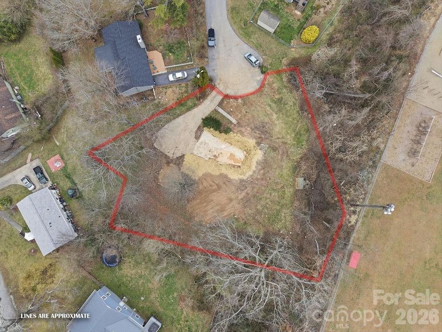 Exceptional opportunity to build in one of Weaverville’s most desirable neighborhoods! This vacant lot is ready for your vision. The previous home has been recently demolished, offering a clean slate and saving you the time and expense of removal so you can move straight into the design and building phase. Enjoy the charm and convenience of being walkable to downtown Weaverville, where you’ll find beloved local restaurants, shops, galleries, and year-round community events. Spend afternoons at nearby Lake Louise Park, complete with walking trails, a playground, fishing, and scenic picnic areas. With its prime location, established surroundings, and unbeatable walkability, this property presents a rare chance to create your dream home in a vibrant, welcoming community just minutes from Asheville.