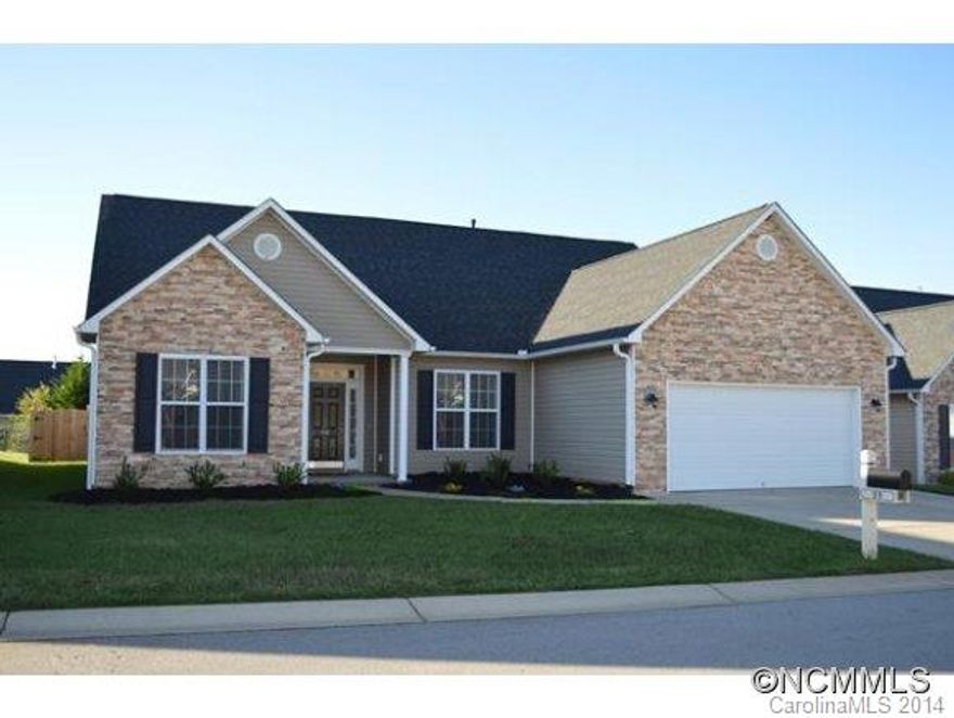 Home in Fletcher's hottest community, River Stone, features an open floor plan, fenced back yard, vaulted ceilings, and easy to care wood floors. This light, airy home with stone upgraded exterior, gas fireplace, and open dining/living spaces is perfect for entertaining. Large walk in closets in master and foyer offer great storage. Add closet to the office for a 4th bedroom. Neighborhood boasts playground, heated pool, and great school district.