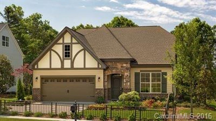 Gorgeous Tudor home with Owners and guest suite downstairs.  2 additional bedrooms and loft upstairs. Screened porch of the back of the home.  Upgraded paint wall color. Granite countertops in the kitchen, 8' doors on the first floor, paver patio,  hardwood on stairs, wood floors, tankless water heater and beautiful crown molding can all be found in this home.