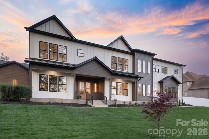 Experience elevated Lake Norman living in this newly completed custom-built modern home in Mooresville, NC, crafted by Revin Projects and designed with intention for luxury, comfort, and effortless everyday living. Offering over 5,100 square feet of refined living space, this exceptional new construction home combines sophisticated design with sought-after lifestyle features including no HOA and community Lake Norman access with nearby boat launch. Step inside to a dramatic two-story great room anchored by a sleek linear gas fireplace, soaring ceilings, designer statement lighting, and curated high-end finishes throughout. The open-concept layout flows seamlessly into the dining area and chef’s kitchen featuring an oversized waterfall island, premium ZLINE appliances, walk-in pantry, and fully equipped scullery with second dishwasher, thoughtfully designed for entertaining and functionality alike. The main-level primary suite is a private retreat with spa-inspired bath complete with heated floors, walk-through rain shower, soaking tub, dual vanities, and custom walk-in closet featuring quartz island and statement chandelier. A dedicated office with custom built-ins and designer accent wall creates the perfect work-from-home environment. Additional main-level highlights include a stylish powder room with statement wallpaper, spacious drop zone, and laundry room with custom dog feeding station and pot filler. Upstairs, enjoy a versatile loft/lounge with wet bar, generous storage, bonus room with half bath, and spacious secondary bedrooms, each featuring private ensuite baths with LED mirrors, designer tile selections, and elevated fixtures. A second laundry room adds convenience for guests. Designed for year-round outdoor living, the private backyard oasis features a heated pool and spa, covered patio, firepit, and putting green, creating the ultimate Lake Norman entertaining experience. Additional upgrades include engineered hardwood flooring throughout, whole-home water purification system, automated irrigation with rain sensor, and expansive 3-car garage with dedicated dog washing station. Located in one of Mooresville’s most desirable Lake Norman areas, this luxury modern home offers the rare combination of new construction, designer finishes, community lake access, no HOA restrictions, and exceptional craftsmanship. All that’s left for you to do is move in!