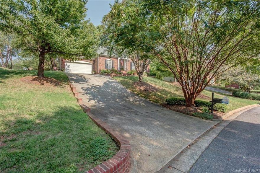 Number of upgrades for this lovely ranch that sits on a hill!  Rear yard is level though and awesome screened in and stamped concrete porch oversees it all!  Conveniently located within walking distance to many amenities such as grocery, restaurants, and not far to Country Club, Swim Racket Club, Martha Rivers Park.  Upgrades inc:appliances in 2009, microwave 2016, Corian countertops, patios and walk way stamped concrete, some new wdws 2010,hot water htr 2017,HVAC 2011,fresh paint 2017