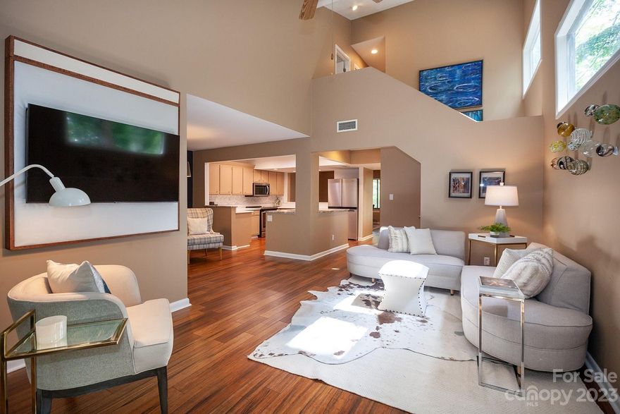 Live the resort life within the gates of River Hills, a premier waterfront community on Lake Wylie. 
This stylish end-unit condo is filled with updates, and lives like a single family home. When you enter the front door, you see through to the back with an open concept layout. A spacious dining room leads to the updated kitchen with quartz countertops and stainless appliances. An island overlooks the breakfast area, and the vaulted living room with fireplace and two sliding doors (lovely view toward the woods, not another building). There are three roomy bedrooms upstairs, including the primary suite with two closets and an upgraded bath. Ample outdoor storage and two assigned parking spots. Relax on the private back patio, or at the complex swimming pool. Amenity-filled neighborhood with country club, marina, walking trails, parks and so much more. Live like you're on vacation every day! Welcome home.