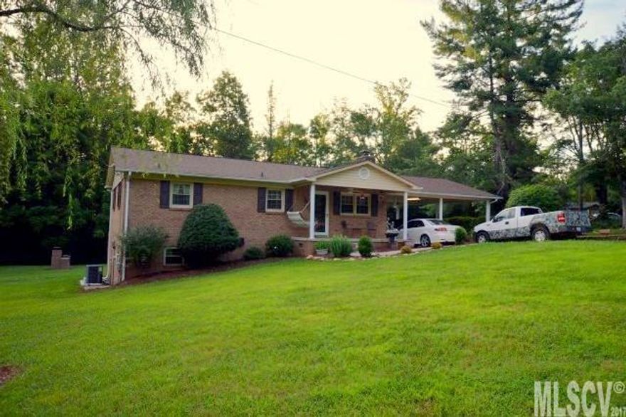 This cozy and inviting brick ranch is sitting pretty on a nicely landscaped 2 acre tract! The spacious living room has hardwood flooring & a gas log fireplace. The eat-in kitchen also has hardwood flooring, solid surface countertops, and french doors leading out a 6x40' deck. The carport is oversized offering 675' of parking space. The basement level would be perfect for an in-law suite or would be great for teenagers as well. It has a nice den, bedroom, full bath, eating and laundry area, and is tastefully decorated. There's plenty of parking & easy access to the basement level if a private entrance is desired. The laundry area would be the perfect place to add a small kitchen. The woodstove offers an alternative source of heat or a great occasional supplemental heat. The detached double garage and workshop has 1087' of space w/ unlimited possibilities. This is a great property and rare find given the acreage, big garage, ample parking, and location in the southern end of the county!
