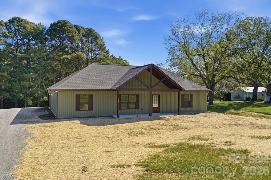 Rare find is this NEW construction home, which sits on a beautiful, level to slightly sloping lot just under an acre, offering the space and privacy you have been looking for.
Welcoming you in is a vaulted front porch, leading into a bright, open-concept living area filled with natural light. The kitchen is designed for both everyday living and entertaining, featuring bar seating, stainless steel appliances, and a seamless flow into the main living space.
The primary suite stands out with a tray ceiling and shiplap accent wall, creating a comfortable retreat. The ensuite bath includes dual sinks, tile flooring, and a spacious walk-in shower with a pebble inlay floor.
A split-bedroom floor plan provides privacy, with generously sized secondary bedrooms located on the opposite side of the home—each offering walk-in closets. A full bath with a tub/shower combo serves this area.
The oversized attached two-car garage (nearly 600 sq ft) is insulated, sheetrocked, and painted—being 24ft deep it's ready for cars, storage, hobbies, or workspace.
Step outside to a covered rear patio overlooking a private backyard with plenty of open space to enjoy.
Low South Carolina taxes and convenient access to Highway 21 and I-77 make this an easy choice for commuters.
Don’t miss this opportunity to own a move-in ready home with room to spread out.