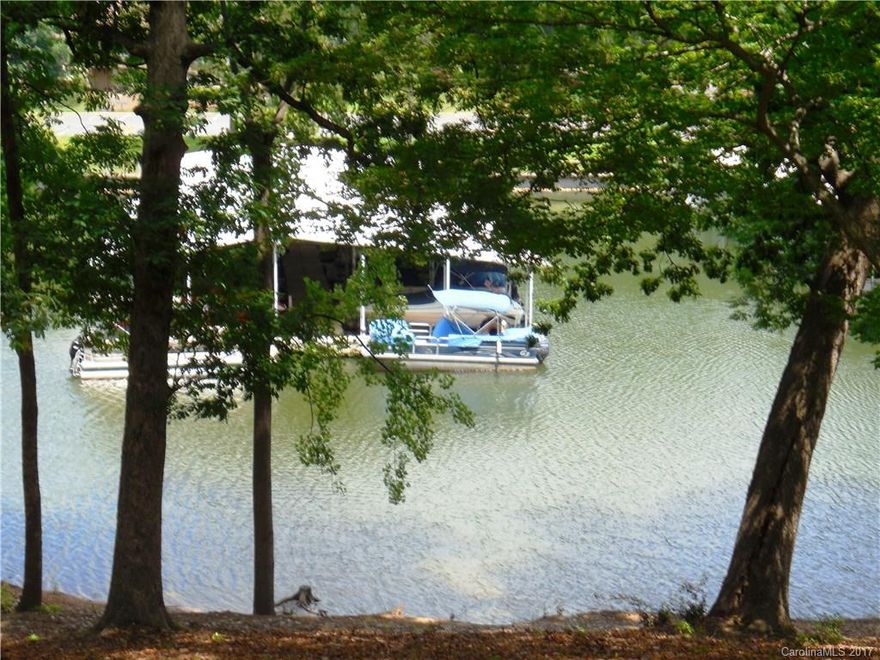 Blissfull waterfront living; priceless vista of the lake from every window! When you live here you're on vacation every day. Enjoy the carefree lifestyle of condominium living in this popular gated community on Lake Wylie; golf, boat, swim, fish, play, and luxuriate. The summer has just begun so don't miss a minute of the fun. All it lacks is YOU. Barely a minute south of the Buster Boyd Bridge into Charlotte. Easy access to the city but live on the lake. Low SC taxes and award winning schools.