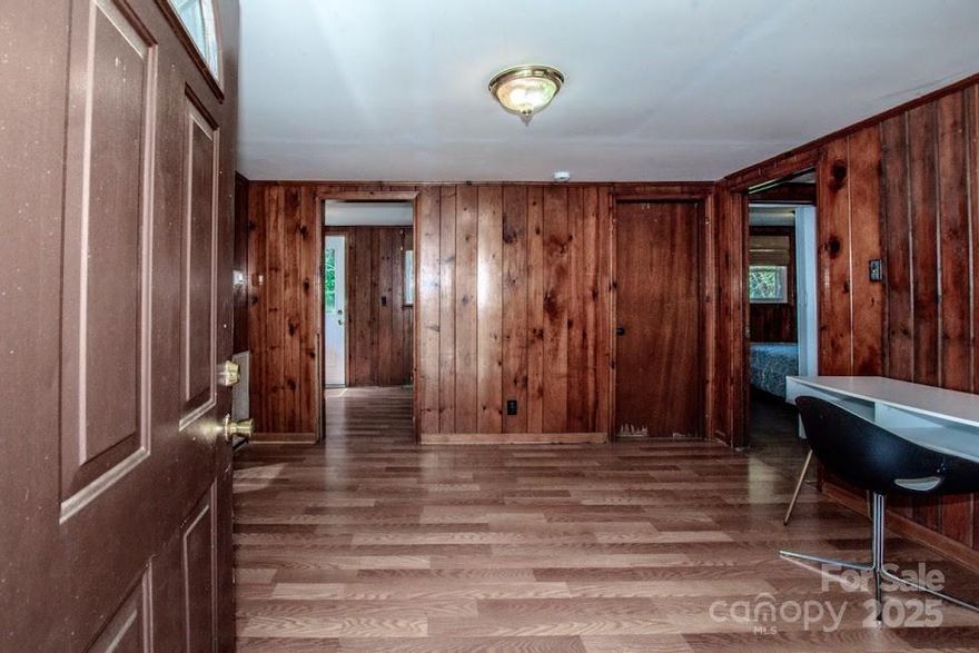 BACK ON MARKET - Don't miss your chance to view! This home had a new roof in 2024 and new plumbing and new hot water heater in 2024! New Back Deck 2025. New shower wall insert in 2025.  HVAC 2021. HOME NEEDS WORK. BEING SOLD AS IS** If you are handy or looking for an investment property look no further! Close to 40 and 77 - Great location! Please reach out with any questions you may have! Enjoy sitting on your covered front porch or grilling out on your new back deck! Relax in the living room which is centrally located to the bedrooms, bathroom, laundry room and kitchen.  Looking to close quickly? We can accommodate a quick close! This home is a must see and won't last!