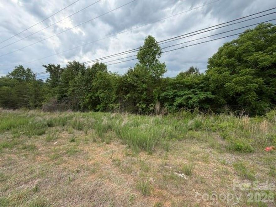 Approximately 17 acres ideally located just minutes from I-40 and Hwy 321 with access from both Old Shelby Road and Oglesby Lane. This versatile property consists of 3 tracts and offers a mix of wooded areas and cleared land, providing endless possibilities for residential development, recreation or investment. A creek runs through the property adding to its natural beauty and privacy. Conveniently located near Henry River Park. Water and sewer are available through Long View (tap fees required). A large power line easement crosses a portion of the property. Great opportunity for acreage close to major highways, shopping, dining and more.