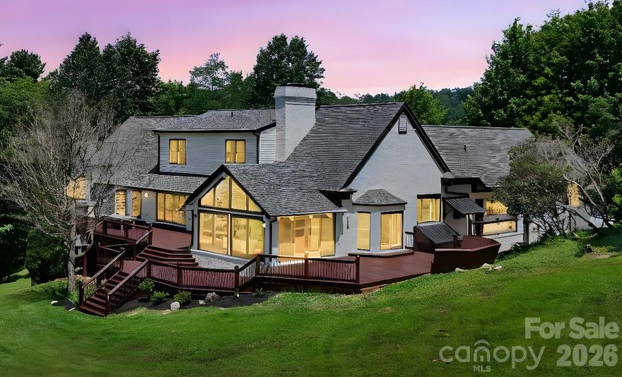 Enjoy peaceful mountain views from this beautifully remodeled contemporary home on 6.84 unrestricted acres in Boone, NC, just minutes from downtown & Watauga Medical Center. This thoughtfully redesigned home offers an open, light-filled main level with spacious living room featuring unique double-sided fireplace connecting to the cozy seating area & remodeled chef’s kitchen. The vaulted sunroom beyond creates a perfect spot to relax or entertain. The main floor also includes an inviting primary suite with large walk-in shower & fireplace in the bath. Upstairs, discover 2 bedrooms with Jack & Jill bathroom & versatile bonus area. The lower level expands living options with 3 additional bedrooms, full bathroom, large game room, home theater, & over 1,100 sq ft of garage/storage space.
Multiple expansive decks, opening to peaceful acreage—ideal for outdoor gatherings & soaking in the natural beauty of mountain living with no restrictions.
STR are permitted.  Furnishings negotiable.  There are few cables of stairwell railing that need adjustment/repair and 4 windows with blown seals.  Seller has estimate for window glass repair.