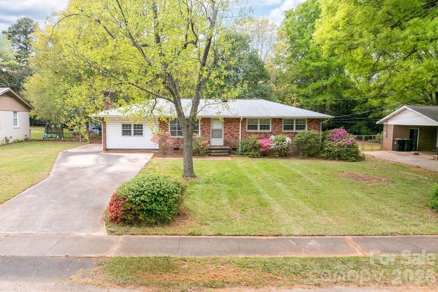 785 Rabun Ln in Rock Hill, SC is a single-story ranch home with 3 bed, 1 bath, over 1,300 heated square feet, a level 0.35-acre lot, and NO HOA. This Rock Hill home features original hardwood floors in the living room, hallway, and all 3 bedrooms, plus new LVP flooring in the kitchen, dining area, and bathroom.

The kitchen features updated cabinets, and improvements include fresh interior paint throughout the entire home, a new sliding glass door, a tankless water heater, and a roof replaced approximately 3 years ago. The family room features a wood-burning fireplace, brand new carpet, and a separate laundry/utility room.

Outside, the fenced backyard includes a large concrete patio with room for outdoor seating, grilling, or entertaining, along with a large storage shed for additional storage.

This home is conveniently located near Cherry Park Elementary School of Language Immersion, Sullivan Middle School, Cherry Park, Rock Hill Tennis Center, Winthrop University, downtown Rock Hill, Cherry Road shopping, dining, and everyday conveniences, with convenient access to I-77. It is approximately 30 minutes to Uptown Charlotte and about 16 minutes to Ebenezer Boat Ramp.