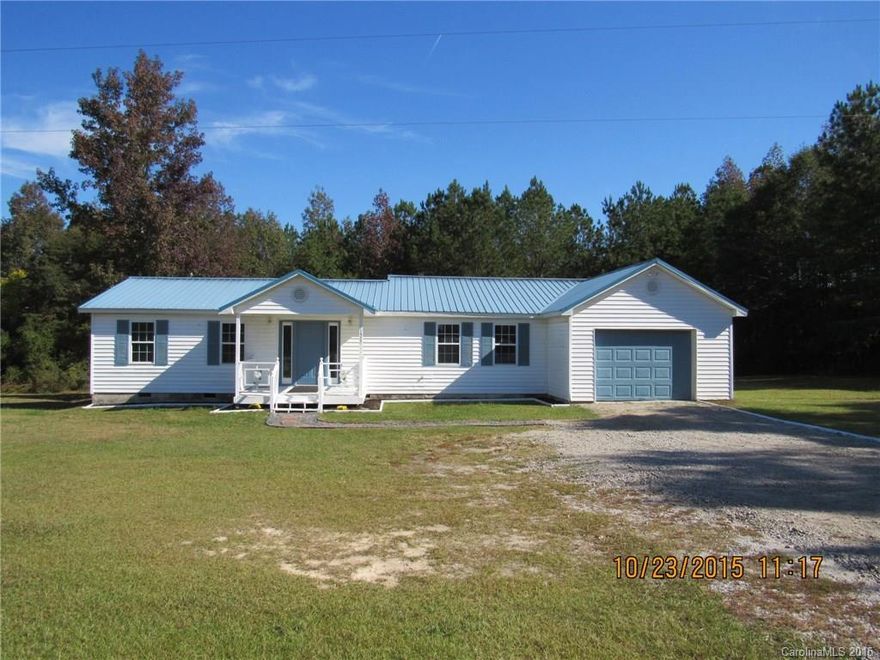 Ready to move in, this 4bed, 2 bath home has been recently painted, new carpet and hardwood floors were just refinished. Clean and ready for you to start making memories. Home is sitting on 1.79 acres, large yard on side and in back, there is a one car garage and extra storage. Come see all this home has to offer.