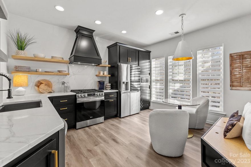 Setting a NEW STANDARD with this GORGEOUS Newly Remodeled Townhome! ALL NEW CABINETS, NEW QUARTZ COUNTERS, NEW QUARTZ BACKSPLASH, AND NEW APPLIANCES! Gas range, modern floating shelfs, new LVP throughout, designer carpet on stairs, STUNNING NEW Modern Stair railing with rod iron and white oak top, NEW walk in pantry, NEW lighting, NEW fans, NEW bar nook with black shiplap and 3 tiered shelf, TRULY UNIQUE feature wall at the stairs, NEW vanity in the powder room, NEW wallpaper, NEW painted cabinets in the full baths, ALL NEW bathroom mirrors, NEW bath faucet fixtures and NEW Shower fixtures in Primary bath, NEW hardware in all baths, NEW expanded opening between the kitchen and dining area for more open feel, built in banquet sitting with storage in the kitchen, CUSTOM CLOSET in the primary Bedroom with a jewelry drawer, 2 valet pulls, clothes drawer and shoe rack AND the list goes on. DO NOT MISS the one of a kind home, a true steal with all these features. Baxter amenities and more!