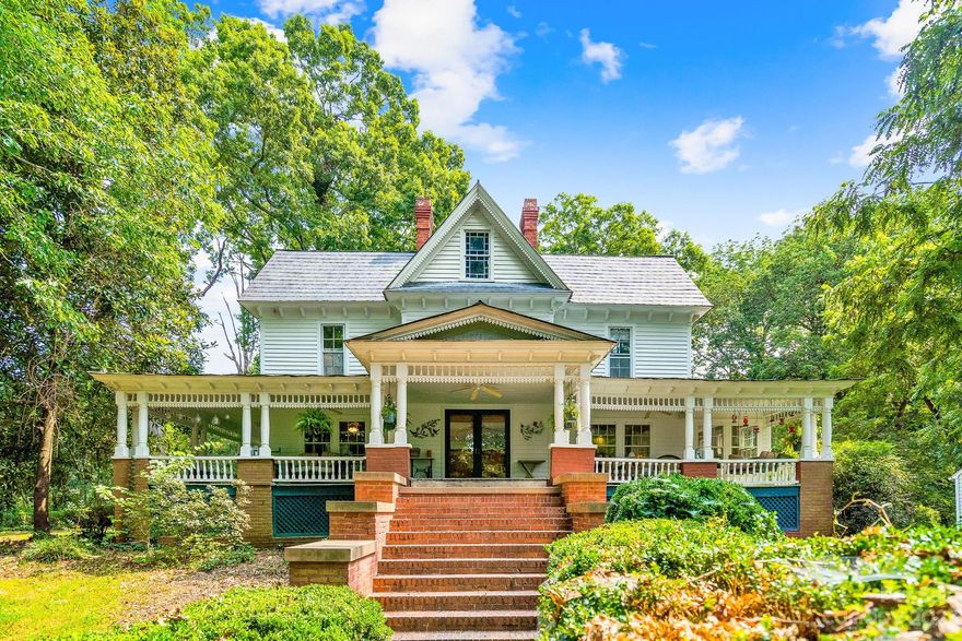 Own a piece of history with an architectural appeal unmatched by today's building design standards. Step back in time to what was the Doctor's house. Sitting in seclusion among the magnolia, black walnut, and oak trees on 9.74 acres. Lovingly maintained and built circa 1850, there is character galore in this 3,295 sq ft, 5 bedroom home. Appreciate the glass door knobs, hand-blown art glass doors, heart pine walls, blue slate rock porch, and built-in shelves. Enjoy both mornings and evenings on the massive wrap-around porch or sunroom. Prep for guests in the updated, main kitchen or the butler's kitchen in the mudroom. Entertain in the living room spacious enough for a baby grand piano. Make your way upstairs to the large sitting room that leads through French doors to the primary bedroom. Four buildings with electricity on the grounds offer plenty of storage. This beauty boasts a welcoming charm and quaintness you won't find anywhere else!