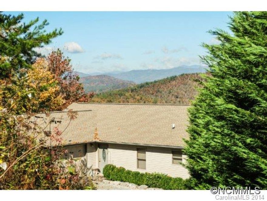 Lovely home with the long range views you have been dreaming about, the home is located in a small neighborhood 20 mins from Brevard.  Like new construction with 1000+ sqft of deck and covered deck, to enjoy the year round view. Hardwood floors and beautiful stone fireplace. Furnishings negotiable. Two bedroom home with two bonus rooms and open plan family room dining and large kitchen.