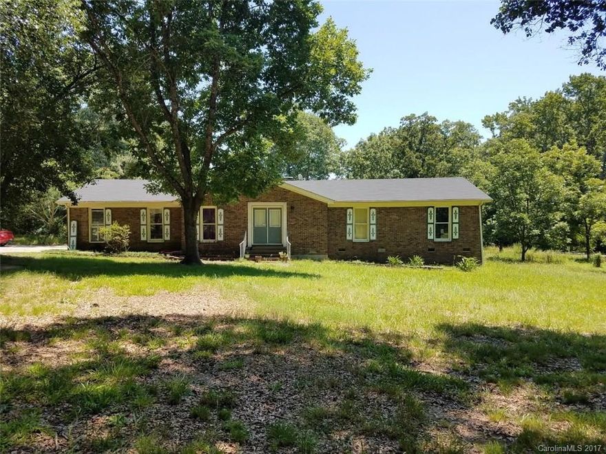 This ranch style brick home with 3 Bedrooms and 2 Bathrooms sits on 1.79 acres of land with mature trees.  In addition to the house, the property has two buildings that are powered and insulated and an additional workshop.  Conveniently located to the interstate and town, this property allows privacy and easy access simultaneously. The home is being sold "as-is" and is just waiting for someone to make it their own.
