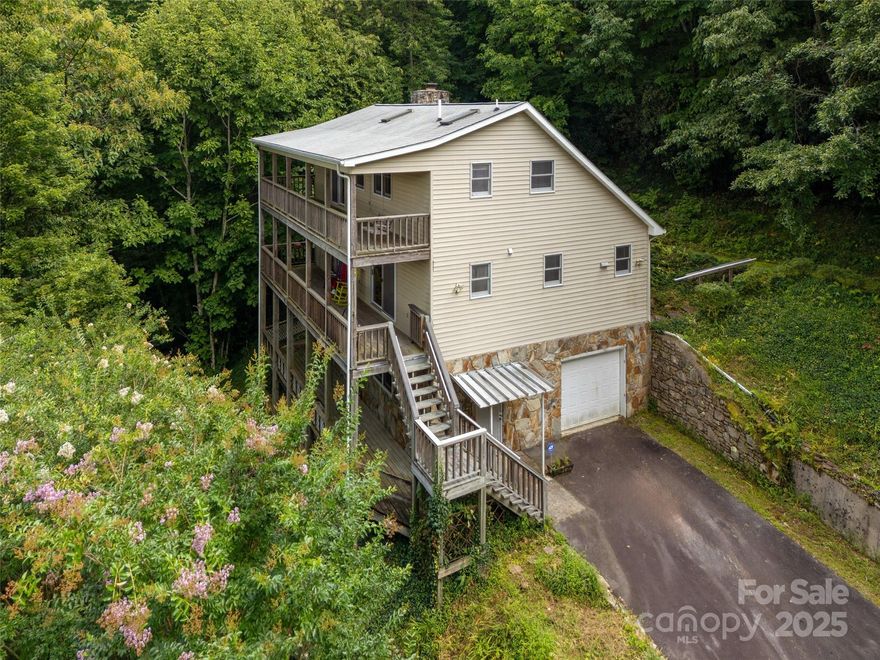 Wonderful mountain retreat on approximately 4.5 acres. Spectacular long range year round views from two large covered decks. Large open plan on main level and two loft bedrooms upstairs. Hardwood floors, stone fireplace, vaulted ceilings all make this a perfect get away home in the mountains. Full unfinished basement with a half bath plus a one car garage. Narrow, steep, paved access from the private gravel road. No HOA but a road maintenance agreement in the deed. Two lots, to be sold as one. The house is on Lot # 12 that is 2.14 Ac.  Lot 10 is 2.34 . Will be deeded as one lot.