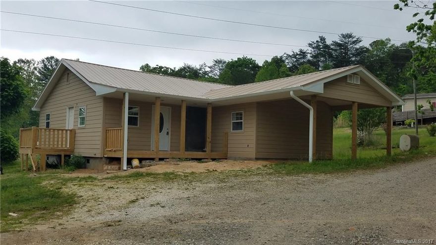 MULTIPLE OFFERS RECEIVED. HIGHEST & BEST DUE BY 5:30 PM 5/24/2017. When completely remodeled house will have: new kitchen cabinets/countertops, new baths, new hardwood floors and ceramic tile, new insulation, metal roof, new gutters, new wood siding, new heat pump, electrical and plumbing updated, and new deck.  Large detached workshop measures 35' x 18'.  Plus carport. In process of completing remodeling.  Located just 10 minutes to Downtown Asheville, but with a country feel!