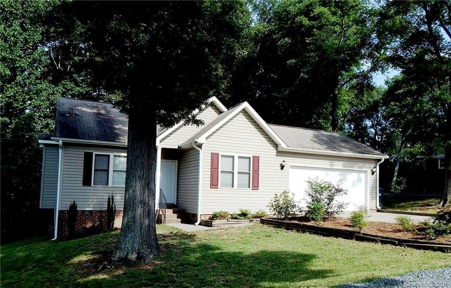 3 Bedroom 2 Bath Vinyl Ranch with a 2 Car Garage on a 1/2 Acre Wooded Lot. Within walking distance to the Robert L. Smith County Park which has a Great 9 Hole Disc Golf Course. Very Open Floorplan. Fenced in Yard ready for your Dog and No HOA. Plenty of Parking in the Double Concrete Driveway as well as a Circular Drive. Large Private Patio with a separate Grilling Platform. Large Utility Storage Building/Workshop in back as well.  Well Maintained Home, Very Clean and ready to move into!