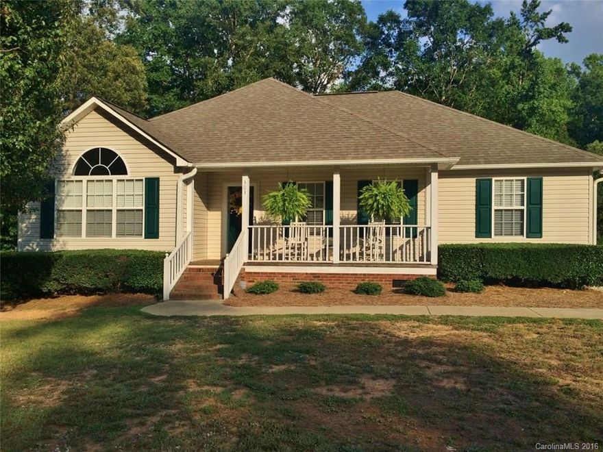 Doll house on 1 acre fenced rear lot. Front porch. 3BR/2BA. Great room with gas log fireplace. Open floor plan. Large eat-in kitchen with hardwood floors & granite countertops. Rear deck. Most of rear yard is cleared with remaining yard wooded in back for privacy. Storage building remains. Roof replaced 2013.