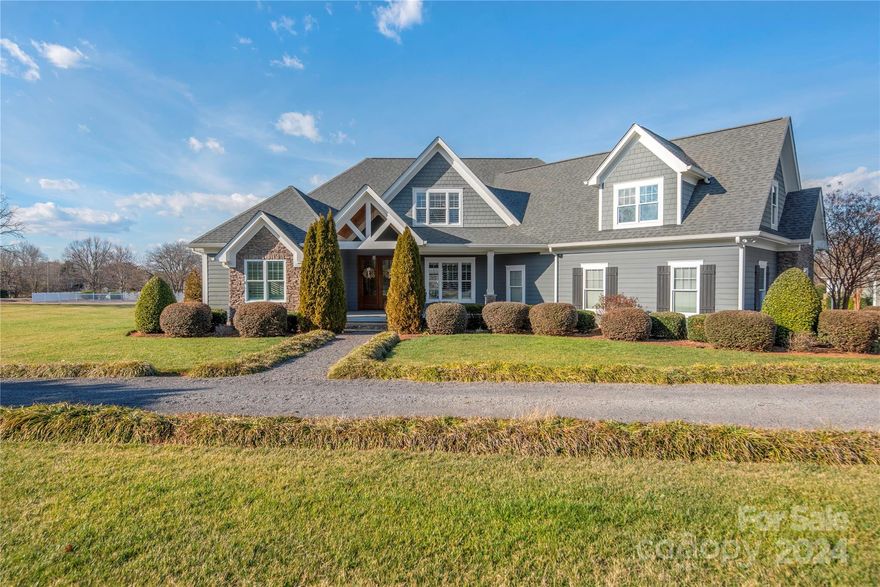 “Some kind of wonderful” are the words that come to mind as you enter this peaceful country living estate. Situated on over an acre, the wide front porch greets you as you step inside the spacious foyer into the open design w/primary bdrm down. You’ll notice the refined architectural details of rounded corners, crafted accent ceilings and plentiful windows nestled in custom window treatments and plantation shutters. The chef’s kitchen includes a Thermador range, microwave drawer and pantry w/water and electricity access to discreetly house appliances and provide your very own coffee bar. This R. Morgan Homes custom build will impress the most selective buyer w/quality of craftsmanship and exquisite details. Back staircase leads to 2 bedrooms w/jack & jill bath, plus bonus w/ensuite bath. Delight in lounging on the back screened porch, sun shelf of the 38’x18’ saltwater pool w/waterfall, fountains, and colored led lights, or relax in the attached spa to unwind at the end of a busy day.