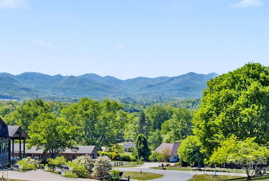 Discover modern luxury tailored for lovers of expansive open-plan living and unforgettable views. This impeccably designed residence frames million-dollar mountain panoramas through floor-to-ceiling glass in a soaring great room that flows effortlessly into a chef’s-caliber kitchen featuring a generous quartz island, artisan mosaic backsplash, oversized farmhouse sink, and gas range. A signature floating staircase, recessed lighting, and a sleek flush-mounted wood-burning fireplace elevate the contemporary aesthetic, while French doors open to a screened, covered deck for seamless indoor-outdoor entertaining. The primary bathroom has a 6 ft enameled cast-iron tub which stays hot for hours.  There is a full house water filtration system & Charcoal filtration system that filters out Chlorine & Fluoride w/ a UV Light to Filter out bacteria, parasites & heavy metals.

The main-level primary suite is a private sanctuary with direct access to the covered screened deck and spa-caliber bath freestanding soaker tub, floating dual vanity, tiled shower and a vast walk-in closet ready for custom organization. Upstairs, two generous bedrooms, a full bath and two versatile bonus rooms provide flexible space for guests, a home office, a fitness studio, or a creative studio. Comfort is optimized year-round with three independent heating and cooling zones, ensuring personalized climate control throughout. Modern, spacious and exquisitely appointed this home delivers refined living and panoramic views at every turn.