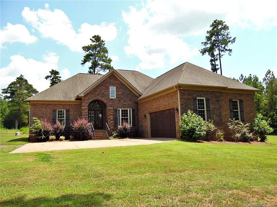 Tucked off the road on a quiet 12 ac lot, this 4 BR/3.5 BA custom beauty is full of high end finishes. Gorgeous lighting, granite & stainless kitchen, double tray ceilings & beautiful hardwoods - this one has it all! Inviting floor plan full of warm natural light w/upstairs that features 4th BR (or bonus), full bath & walk-in closet. Easy access to I-77. Truly a rare find! Strongly encouraged that offers include proof of funds/pre-approval & is required for seller's final acceptance.