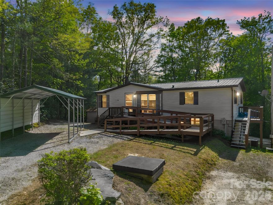 Tucked away in a private setting just minutes from Hendersonville, this inviting home offers the ease of main-level living with potential for additional living space. The unfinished basement is plumbed, providing a great opportunity to expand and customize to suit your needs. Outside, you'll find a versatile barn/workshop and a couple storage sheds-perfect for hobbies, equipment, or extra space. Peaceful surroundings, functional improvements, and room to grow make this an excellent opportunity for a first time buyer or anyone seeking a quiet retreat with convenience nearby.