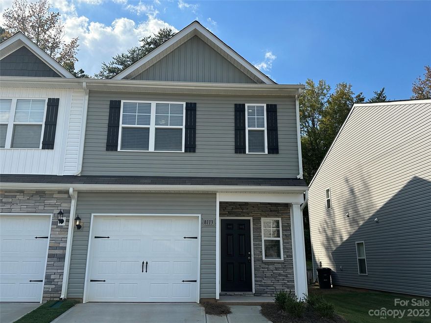 Welcome to this charming end unit townhome nestled in the Townes of Kingstree community, just off Harrisburg Road. As you walk through the first level, you will notice the modern kitchen, boasting gleaming stainless steel appliances, elegant granite countertops, and a convenient pantry for all your storage needs. Heading to the second level, you'll discover the perfect layout for comfortable living. All three bedrooms are situated on this floor, providing privacy and convenience. The spacious primary bedroom is a true retreat, complete with an en-suite bathroom and a sizeable walk-in closet. This home features an attached single car garage that is equipped with a pre-installed outlet, ready to accommodate an EV charger. Residents in this community not only enjoy access to the neighborhood amenities, but also to the surrounding areas which offers a blend of restaurants, entertainment, and shopping.
