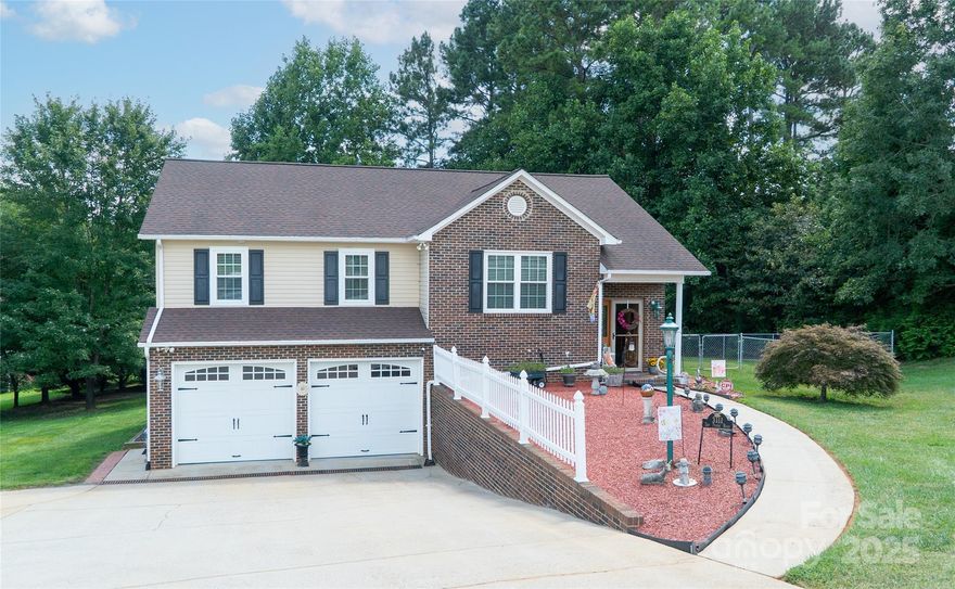 Extremely well maintained home that is move in ready in the Doe Run Subdivision. Minutes away from Lake Rhodhiss, Town of Granite Falls and HWY 321. Enjoy the open floor plan of the kitchen, dining and living room with cozy fireplace. Downstairs offers an office, den, half bath and workshop with double doors leading to the 2 car garage. Relax on the rear deck that overlooks the fenced in backyard. Wall mounted TV's in the bedrooms will convey with the property.