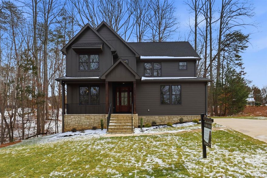 Luxury new construction by Birchstone Homes in the desirable Quinlan Estates community, set on a private 1.07-acre wooded, corner lot. This designer 4-bedroom, 2.5-bath home offers over 2,900 square feet of high-end finishes that set it apart. Inside, you’ll find engineered hardwood flooring, a dramatic two-story living room with expansive windows & an upstairs balcony overlook that enhances the open, airy feel. The chef’s kitchen is the heart of the home, featuring quartz countertops, tile backsplash, custom wood range hood & upscale THOR appliances. It flows seamlessly into the dining area with peaceful backyard views. A dedicated home office with custom trim work provides the perfect work-from-home setup, while the laundry room with sink & abundant cabinetry adds everyday convenience. Upstairs, the primary suite is a private retreat featuring a custom walk-in closet & ensuite bath with soaking tub, walk-in tile shower & double-sink vanity. Upstairs, three spacious secondary bedrooms share a fully upgraded bathroom with tile shower & dual-sink vanity. Enjoy outdoor living year-round, from the covered back porch overlooking the peaceful, wooded lot. Conveniently located just a 15-minute drive to charming downtown Lincolnton with local restaurants, shops, and everyday conveniences, as well as Betty G. Ross Park, offering a recreation center with pool, playground, sports courts, disc golf, river access & more. Zoned for top-rated North Lincoln High School, this home combines luxury finishes, functional design & peaceful surroundings in one exceptional package.