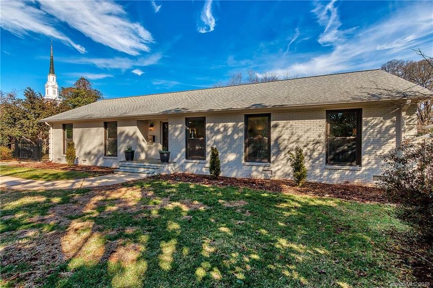 Lovely Remodel on prestigious Providence Road. Painted brick ranch with all the updates you have been looking for.  Renovated by Silver Bee Designs, this hot design duo, has infused a bit of glam into the traditional. They opened up the walls creating a great flow with beautiful light. They replaced or renovated everything so the new owner will have nothing to do but live the good life. Gorgeous kitchen with white shaker cabinets, quartz countertops and stainless appliances. Your guest will love hanging out at the island watching you cook! There is a cozy family room with two sided fireplace. Great flex space! Both bathrooms were gutted to the studs and now feature new tile, fixtures, and vanities.  You'll love the gorgeous hardwood floors finished with Silver Bee Signature stain.  Don't miss the large flat back yard with room to toss the football or your dog pals to run zoomies for hours.  Large attached carport features a ramp for easy access.  Walk to shops and restaurants.