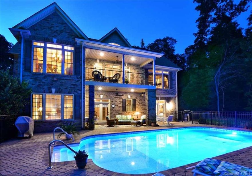 Magnificent Waterfront Home! Exceptional quality throughout this 3-BR, 2-Full baths & 2-Hlf bath home. Granite, wood flooring, tile, gorgeous moldings, upscale lighting, beautiful cabinetry throughout this home. Fabulous large windows overlooking the lake, open floor plan with master suite on main floor. Finished basement with extra den that opens up to a beautiful in-ground pool and the lake! Professionally landscaped, 2-car garage, flat lot with wonderful boathouse & great view of big water.