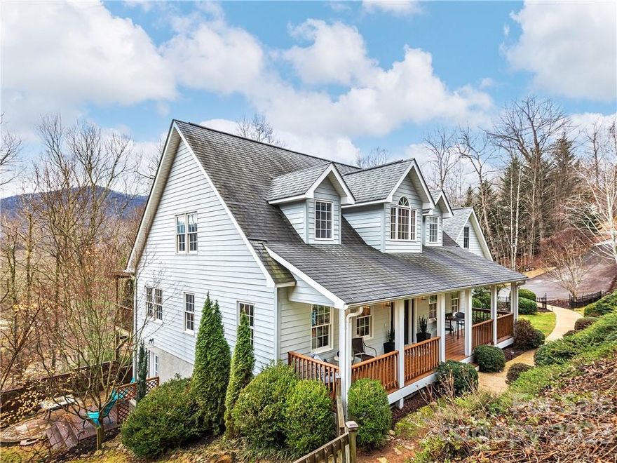 This lovely Cape Cod home is located just over a mile from access to miles of walking trails in the Pisgah National Forest. Enjoy the winter mountain views from the large back deck or the hot tub off the basement level. The primary suite is on the main level with walk-in closet, double vanity, large soaking tub, & walk-in shower. Updated eat-in kitchen with large island & pantry with direct access to the back deck. Bonus room near kitchen & half bath. Upstairs is two generously sized bedrooms with walk-in closets and a full bath. Basement level includes family room, craft/hobby room, & an unfinished room previously used as a workshop. Inspection report provided.