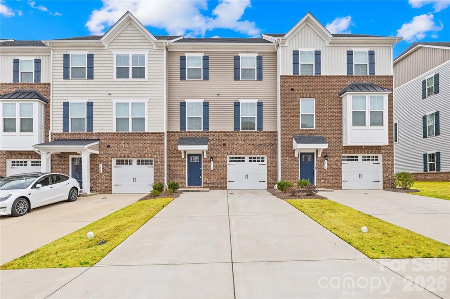 Beautifully maintained, like-new 3-story townhome in the desirable Grantham Place community in Fort Mill offering approximately 1,902 sq ft of functional living space with 3 bedrooms, 2 full bathrooms, 2 half bathrooms, and a front-entry one-car garage.

The entry level features a versatile flex space ideal for a home office, workout area, media room, or additional living space along with convenient garage access. The main living level offers a bright open-concept layout with abundant natural light, spacious living and dining areas, and a modern kitchen featuring quartz countertops, stainless steel appliances, gas range, pantry, and ample cabinet storage. Step out onto the private deck directly from the dining area, perfect for relaxing or entertaining. A convenient half bathroom is also located on the main level.

Upstairs, the spacious primary suite features a walk-in closet and private bathroom, while two additional bedrooms, a full bathroom, and laundry area complete the upper floor.

Enjoy resort-style community amenities including a swimming pool, tennis courts, pickleball courts, playground, clubhouse, and more. Conveniently located near Baxter Village, Kingsley, Historic Downtown Fort Mill, Harris Teeter, shopping, dining, and with easy access to I-77 and nearby Ballantyne, Pineville, Indian Land, and Charlotte.