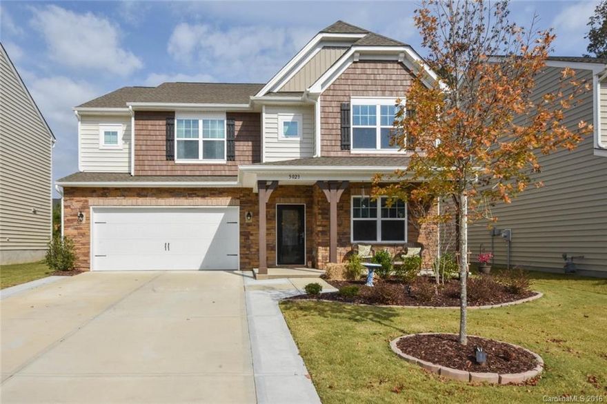 This spacious home features 5 BR and 4.5 BA in the sought after Carolina Reserve community. The kitchen has granite counters, center island and gas cook top. Great room w/ stone faced gas log fireplace and pre-finished wood floors throughout first floor. Main level guest suite and office/study.  Large second floor loft opens to owner's suite and remaining bedrooms. Home sits on cal-de-sac lot within walking distance to community amenities. Close to dining/shopping and a short drive to uptown.