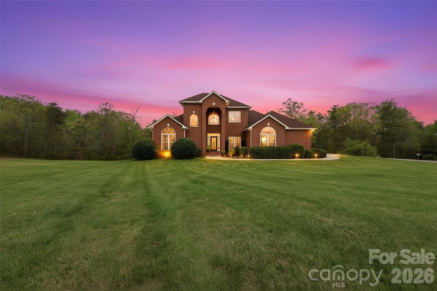 Exceptional all-brick executive-style home in Taylorsville, offering space, versatility, and comfort for every stage of life. Situated on Lots 16 & 17 totaling 1.52± acres, this property provides the perfect balance of privacy, usable land, and convenience to Statesville, Hickory, Lenoir, Wilkesboro, and even Charlotte.

The main level features a spacious living room, well-appointed kitchen, dining area, and mudroom, along with two bedrooms and two full baths. The primary suite is generously sized, with a luxurious ensuite bath and direct access to the back deck—also accessible from the living room—creating an effortless flow for indoor-outdoor living. Upstairs, two generously sized bedrooms share a full bath, offering room for family or guests.

The basement is a true highlight, with a large media room featuring a fireplace and lounging area, plus a finished craft/workout room and full bath. The unfinished portion includes a one-car garage, utility space, and ample room for storage or workshop use. Additional features include a two-car garage on the main level and quality all-brick construction throughout.

This home combines style, function, and location, offering the flexibility to entertain, work, relax, and enjoy life while remaining connected to the surrounding communities. Schedule your showing and see how this property can fit your lifestyle.
$649,900