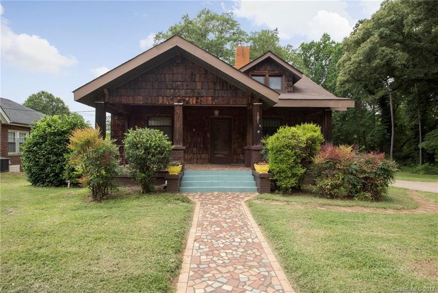 This charming four bedroom three bath Craftsman Style home is located within walking distance to downtown Belmont.  Enjoy dining, shopping, and a park within just a short walk.  This 1920s home is loaded with wonderful character such as original hardwoods and fireplaces.  This home is located on a large lot, approximately 3/4 of an acre, and is being sold "As Is".