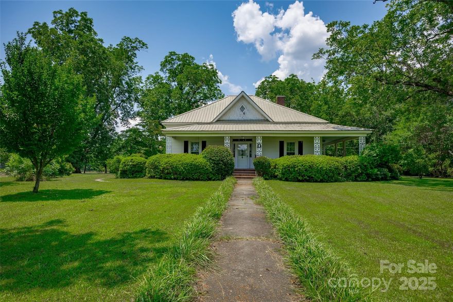 This 1913 farmhouse is more than just a home, t’s a slower pace, a fresh breeze, and three wide-open acres to finally breathe. Just 10 minutes from Lake Monticello and tucked outside of Winnsboro, it’s the kind of place where mornings start on the porch with coffee and end with sunsets over your own piece of countryside. Inside there are 2 spacious bedrooms, 2 full baths, a formal dining room, two living areas, hardwood floors, a gas log fireplace, and a casual, welcoming layout. Out back, there’s a rustic outbuilding with its own fireplace, part workshop, part hangout spot, part “figure it out later” space. Covered storage on one end, open potential on the other. It’s ready for whatever you dream up. This home is full of old soul, timeless character, and that charming, lived-in feeling you can’t replicate. If you’re someone who gets the magic of an old home and wants to make it your own, this one will speak to you. It’s quiet. It’s timeless. And it’s waiting for someone with a little vision and a whole lot of heart.