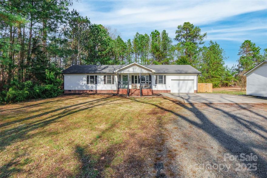 Nestled on a spacious 1-acre lot, this charming 3 bedroom, 2 bath home offers the perfect blend of country living and comfort. The covered front sitting porch invites you to relax and enjoy the surroundings. Inside, laminate wood floors flow through the main living areas, complemented by a neutral color palette that enhances the inviting atmosphere. The adorable kitchen features stainless steel appliances and a cozy breakfast area with a large picture window overlooking the front yard. Step outside to the back deck, which opens to a privacy-fenced yard with a shed, offering ample space for outdoor activities and storage. Conveniently located just minutes from Black's Peaches, Windy Hill Orchard, and downtown York, this home combines a serene country feel with excellent access to local amenities and an easy commute to both Charlotte and Rock Hill.