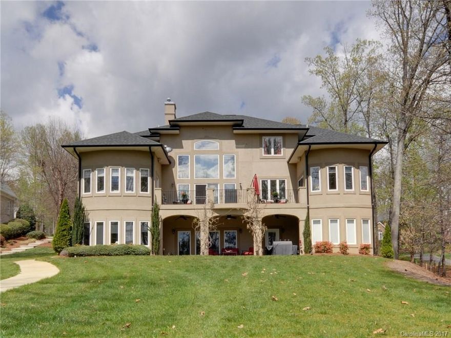 Exquisite waterfront custom home w/stunning details. Open floor plan w/wall of windows that showcase the gorgeous view. Gourmet kitchen w/large sitting area. Luxurious master ste w/fireplace, stunning bath & 2 walk in closets. Upstairs features loft, bonus & 2 spacious bedrooms each w/full bath. Lower level 2nd living quarters w/kitchen, office, 2nd master, exercise room & huge recreation room w/fireplace.  Home is beside a gated, neighborhood use only boat ramp that offers additional privacy.