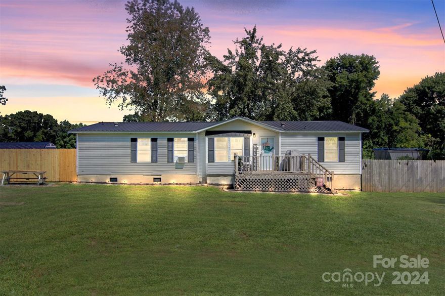 Remodeled Spacious Manufactured home featuring 3 bedrooms, 2 baths, and a fenced in back yard close to HWY 321 and schools/restaurants/grocery stores! This affordable home is absolutely adorable and ready for new owners! You'll love the open concept living space with split bedroom floor plan! These sellers replaced the flooring, light fixtures, cabinets, appliances, countertops, doors, hall bath was completely remodeled, and the primary bath features new vanity, toilet, and refinished tub and shower! The home is close to everything and yet tucked away and private! Only a 17 minute driving distance to Hickory, 15 minutes to Lenoir, 40 minutes to Blowing Rock, 54 minutes to Boone, and an hour 13 minutes to Charlotte.