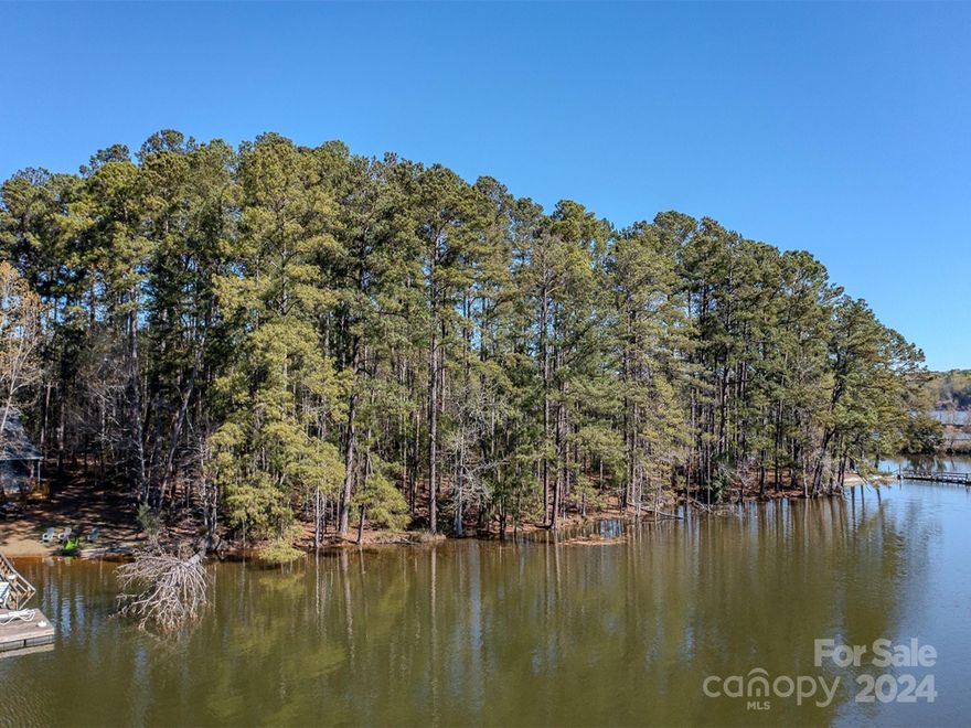 If you’ve been looking for lake front property that’s larger than a postage stamp, this rare find is definitely one that you will want to check out.  Located in northern Stanly Couty, this gorgeous property sits on Harper Hearne Lake on Catfish Road.  Harper Hearne Lake is a beautiful 50+/- acre lake that provides seclusion from adjoining Badin lake, and offers wonderful recreational opportunities.  This property’s 1.53 acres and 200 feet of lake frontage offer a larger piece of paradise than one would normally find on available lake front properties.  This property is located within minutes of New London, Badin, and Albemarle, making it a convenient permanent home site or getaway spot.  

This beautiful property has mature pine trees that provide a serene setting for a peaceful homesite.  Per Cube Hydro Carolinas, the shoreline management company, a dock will be allowed so bring your boat and enjoy the Lake Life you’ve always dreamed about.