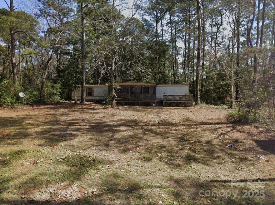 Don’t miss this incredible opportunity to own a prime piece of property in Supply, NC, just minutes from the pristine sands of Holden Beach and close to shopping, dining, and entertainment. Whether you're looking to build a beach getaway, place a new manufactured home, or hold for future development, this versatile lot offers endless potential.

The property currently features a single wide manufactured home that is in poor condition and will need to be removed. It is being sold strictly "as-is", with no repairs or improvements made by the seller.

Enjoy the charm of a quiet coastal community while still being conveniently located to all the essentials. With its proximity to the beach and surrounding amenities, this lot offers a fantastic investment for builders, developers, or savvy buyers seeking value and location.