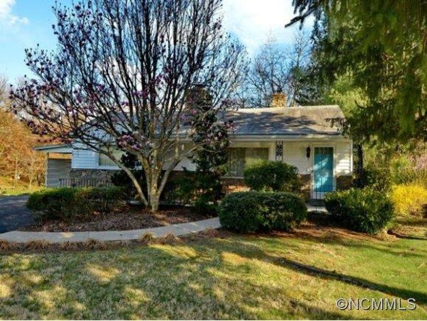 New Lower Price on this sweet bungalow in a great location. Cute retro kitchen, covered front porch, carport on main level to porch patio in the backyard. Level to gentle rolling yard. New windows, wood burning fireplace, big dining room, stainless steel island with stools. Come see this artsy and hip bungalow!