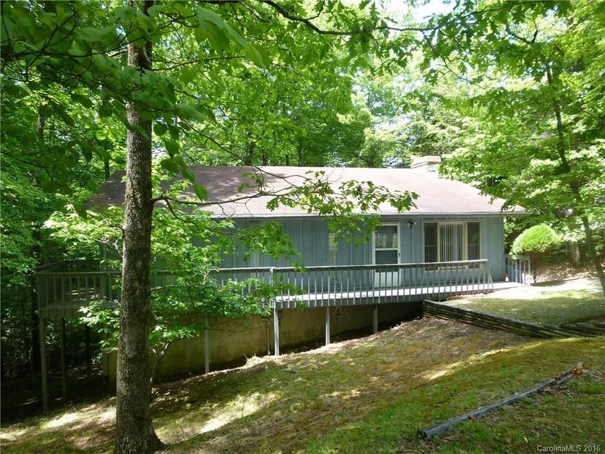 Looking for a house needing TLC to make your own? Then this is the house for you. Conveniently located in the residential gated community of Connestee Falls. Nice level circular drive, front and back  open and screened decks, open floor plan with rock wood burning fireplace in living area. There is a potential long range mountain view with approved tree vista pruning. The house is being offered "As-Is Where-Is". Buyer new to CF to pay CFPOA UAFee of $8,000.