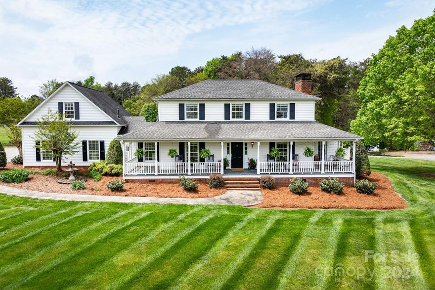 Welcome to 8698 Rocky River Rd... Perched on over 7.5 acres of picturesque countryside, this bucolic home is the perfect retreat.  The property embodies the quintessential allure of rural living while providing easy access to urban amenities. As you approach the property you are greeted by lush landscaping, setting the tone for what awaits within. The home itself exudes timeless elegance with its classic architecture and oversized front porch, perfect for enjoying a morning cup of coffee or evening sunset. Fenced pasture and 1200 sq.ft. outbuilding are conveniently sited within the acreage.  Hardwood floors and natural stone accents create an atmosphere of rustic sophistication, while large windows flood the space with natural light offering stunning views of the surrounding landscape and perfectly sited pool. In addition to 3 bedrooms this home offers 2 bonus rooms and a home office. Create lasting memories with loved ones at this property, truly an opportunity to have it all! No HOA!