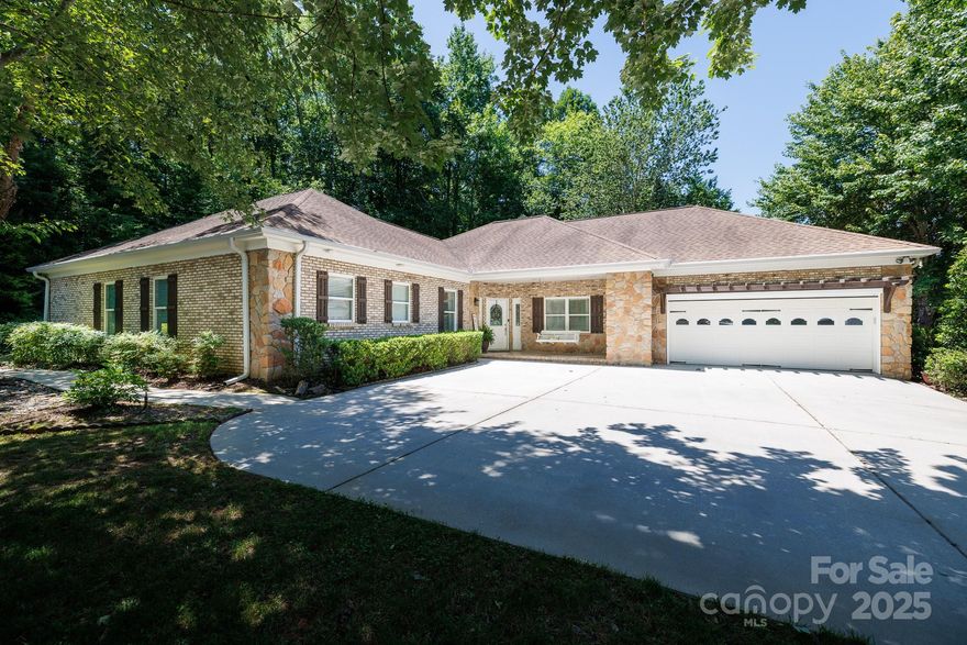 Beautiful one-story brick ranch. Enjoy an evening swing on the covered front porch overlooking beautiful landscaping. This home showcases an absolutely gorgeous kitchen with white quartz countertop island that compliments the black leathered granite, white cabinets and a custom-built range hood. The open kitchen has a beautiful large farmhouse sink that overlooks the great room and breakfast area. The perfect layout for entertaining. There's a formal dining room for extra large crowds. Screen porch for backyard privacy and a pergola covered patio perfect for grilling. All three bedrooms have their own private baths and a half bath for guests. The laundry room is oversized with a utility sink and space for a stand up Freezer or extra refrigerator. Home also features a Home Office. Garage door has a remote screen.