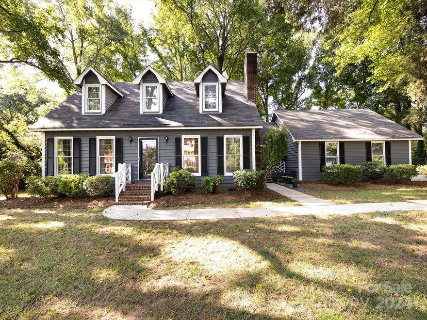 Nestled on nearly half an acre, this charming Marlstone home with NO HOA, offers 1,905 square feet of comfortable living space w/3 bedrooms, 2.5 baths, a versatile office located just off of the kitchen and a 2 car garage which features a covered side porch/walkway leading into the home.  Inside, you'll find granite countertops in the kitchen, hardwood floors on the main level, and new carpet throughout the home (2024). There are lots of living spaces 
throughout the downstairs including a family room w/a fireplace. Upstairs bathrooms feature new LVP flooring (2024). You'll find walk-in closets in 2 of the bedrooms and attic dormer closets providing extra storage. Freshly painted inside & out (2024), this home also boasts new garage doors (2024), a recently installed water heater (2023), an updated HVAC system (2021) for the upper level & a vapor barrier installed (2024). Enjoy the deck located just off of the dining room with an awning for cover & the expansive, fenced back yard.