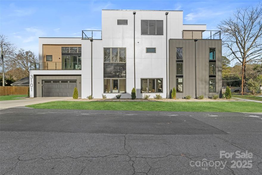 Stunning new construction home offering exceptional design and space across three levels. Enter into a breathtaking three-story open great room that seamlessly flows into the dining area and chef’s kitchen, all accented by elegant beamed ceilings. The kitchen is a showstopper with dual islands, wall-to-ceiling cabinetry, a gas stove with pot filler, and a designer tile backsplash. A built-in desk area features custom shelving and wine storage, perfect for both function and style.
The main level includes a private office or secondary bedroom with an ensuite bath. The luxurious primary suite boasts beamed ceilings, a ceiling fan, and a sliding door that opens to the patio. The spa-inspired bath features a dual-sink vanity and an expansive wet area with a soaking tub and walk-in shower. Spacious secondary bedrooms each offer private baths for added comfort and privacy.
The third floor is ideal for entertaining or relaxing, featuring a large, light-filled loft with abundant cabinetry, a small sink, and a wine refrigerator. A generous fourth bedroom with direct bath access completes this level. Step out onto the third-floor deck to enjoy beautiful views and outdoor living. This exceptional home combines thoughtful design, upscale finishes, and versatile spaces throughout.